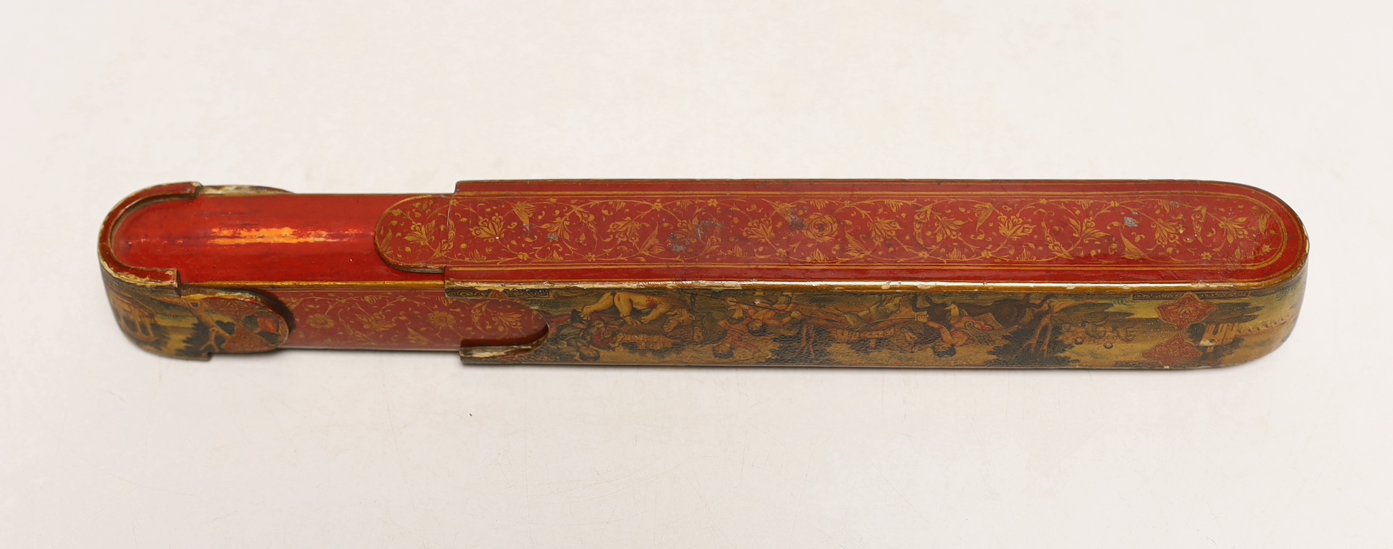 A Persian Qalamdan papier mache scribes or pen box, Qajar dynasty, 22.5cm in length